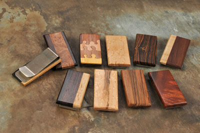 Phil and Teresa Holcomb make high-end handcrafted reclaimed wooden items, such as cufflinks, money clips, bookmarks, bottle stoppers, and other gifts that appeal to the wedding market.